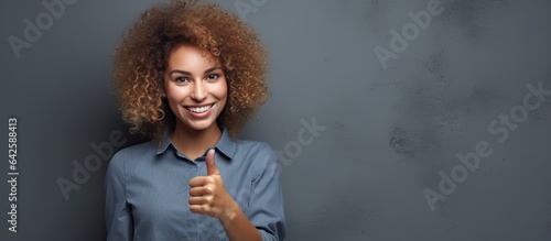 Blonde woman smiling pointi...