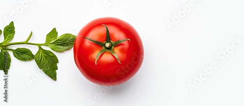 A white background showcases a fresh tomato from above