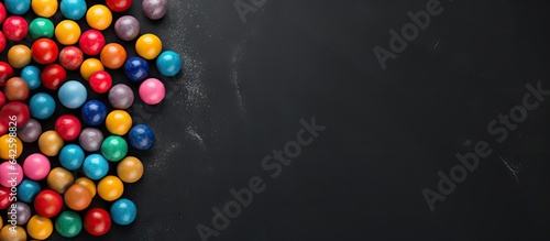 Colorful candy balls on gra...
