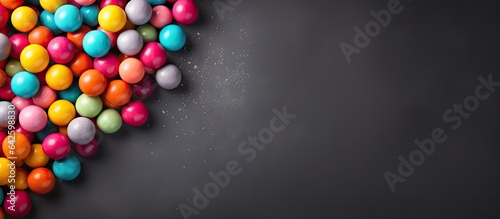 Colorful candy balls on gra...