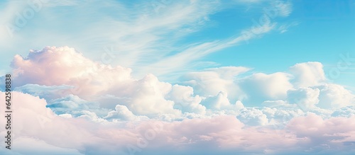 Colorful clouds isolated against pastel blue skies in a dramatic cloudscape