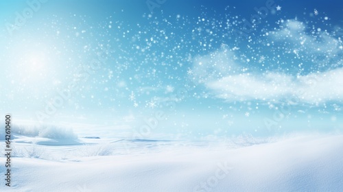 Winter snow background with snowdrifts, with beautiful light and snow flakes on the blue sky ,16:9, copy space © Christian