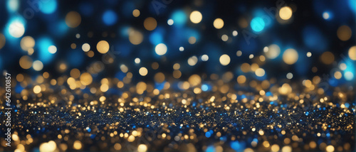 background of abstract glitter lights. blue, gold and black. de focused. banner