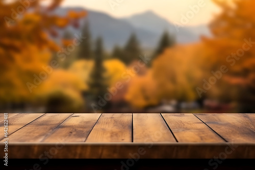Empty wooden table with blur background of autumn landscape