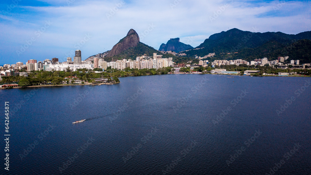Aerial view of Rodrigo de Freitas Lagoon on a beautiful winter morning in Rio de Janeiro. In the background, the Dois Irmãos and Pedra da Gávea mountains.