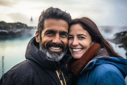 Couple in their 40s smiling at the Blue Lagoon in Grindavik Iceland