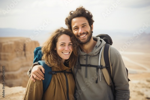Couple in their 30s smiling at the Masada in Southern District Israel