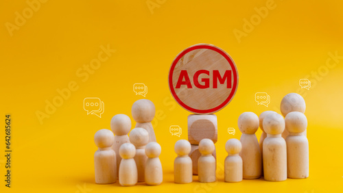 Conceptual image of a group of people with the word AGM. business concept. AGM annual general meeting photo