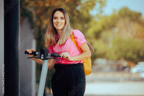 Modern Businesswoman Renting an Electric Scooter in Big City. Woman using an ecofriendly mode of urban transportation 
