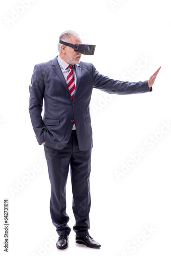 Old businessman wearing virtual glasses isolated on white © Elnur