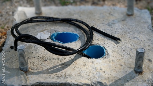 Wires tethered out of the pipes of the mortar platform.