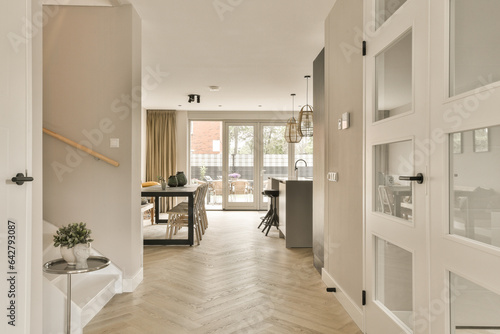 Εκτύπωση καμβά a hallway in a house with wood flooring and white trim on the walls there is an