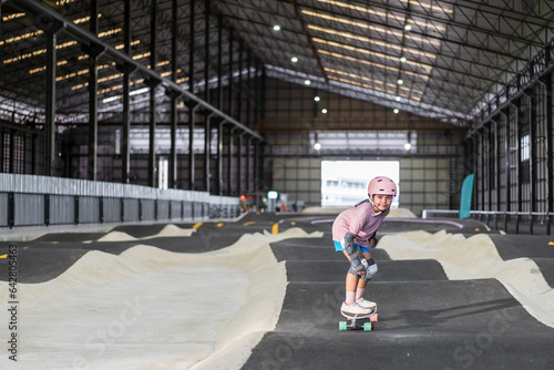 Photography asian child skater or kid girl fun playing skateboard or smile ride surf skate i