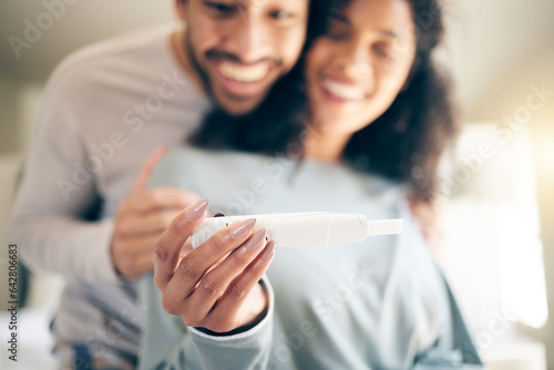 Pregnancy test, hands of woman and happy couple, smile and baby announcement together in home. Pregnant, person and new mother, fertility and support for positive results and ivf success or news photo