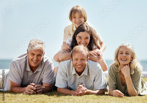 Happy family, picnic and grandparents with child and parents on tropical vacation or outdoor holiday for bonding. Portrait, smile and kid with grandfather travel with mother, father and grandmother © Talia Mdlungu/peopleimages.com