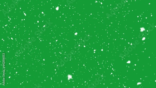 Snow falling on green screen background photo