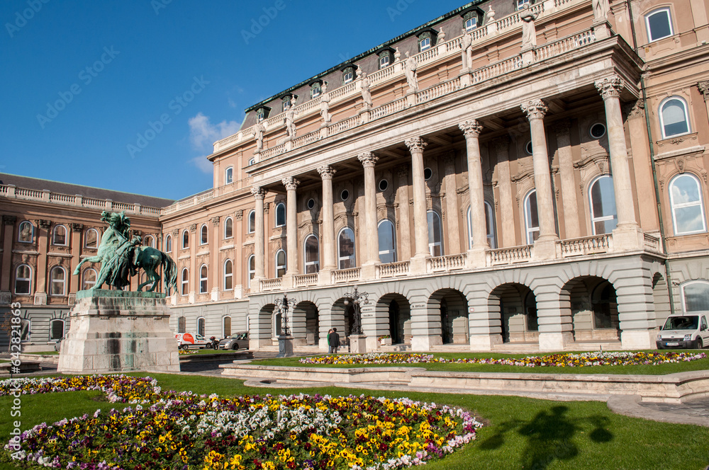 National Gallery and Castle in Budapest, Hungary in autumn with horse statue and flowers.