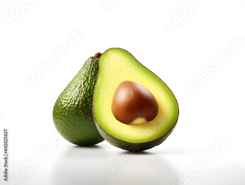 Avocado cut in half isolated on white background. Clipping path, fruits that are rich in good fatty acids and also help reduce bad cholesterol levels. High fiber helps with the digestive system