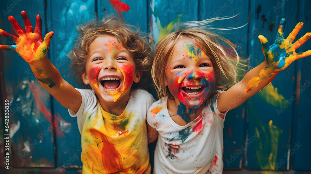 Obraz premium Kids laughing and having fun shows dirty hands with colorful paint