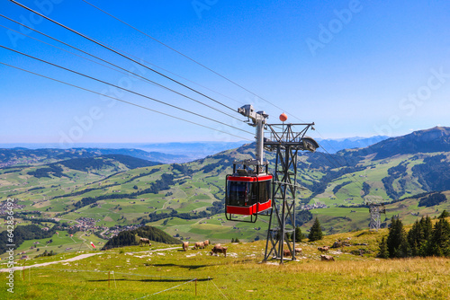 Red cable car from Wasserauen to Ebenalp mountain in the Swiss Alps in Appenzell region, Switzerland