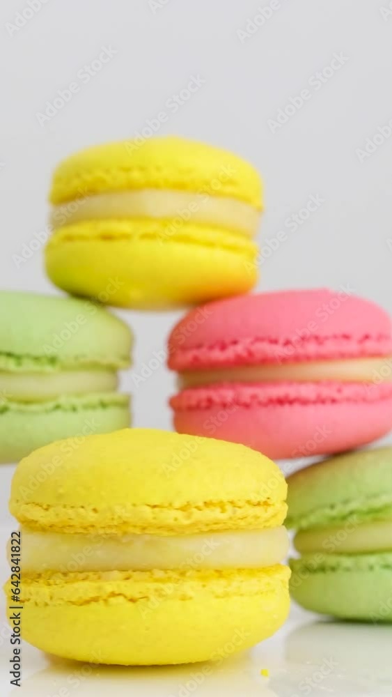 Close up of colorful macarons cakes. Small French cakes. Sweet and colorful dessert with vintage pastel tones. . High quality photo Close up of colorful macarons cakes. Small French cakes. Sweet and colorful dessert with vintage pastel tones. . High quality photo