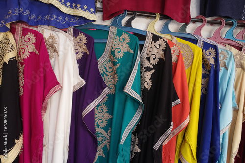 Marrakech, Morocco - Feb 10, 2023: Colourful long ladies dresses for sale in the Marrakech Souk markets