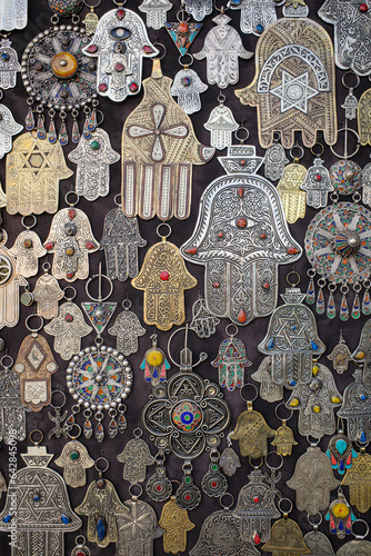 Photography Marrakech, Morroco - Feb 10, 2023: Metal charms and pendants in the form of the