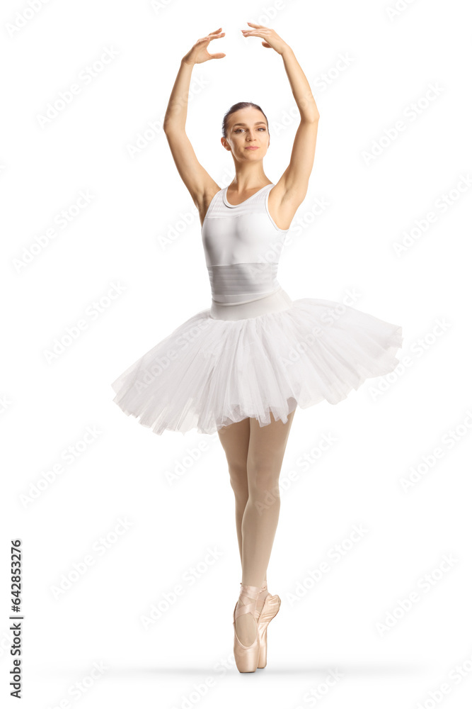 Full length profile shot of a ballerina in a white tutu dress dancing with arms up Full length profile shot of a ballerina in a white tutu dress dancing with arms up