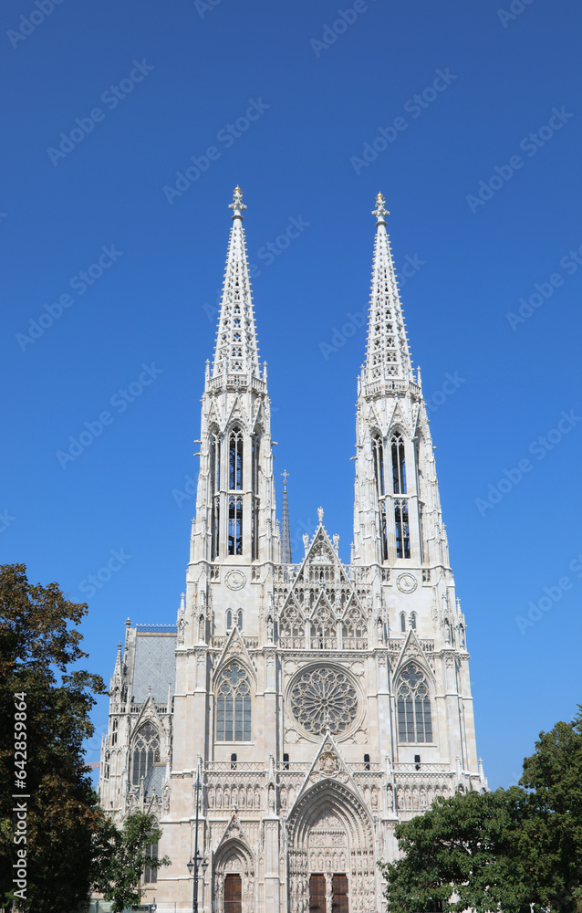 two very high bell towers of the VOTIVE CHURCH called Votivkirche in Vienna in Austria in europe