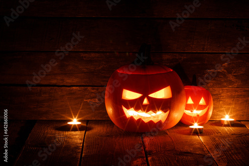 Three Halloween Pumpkins and candles