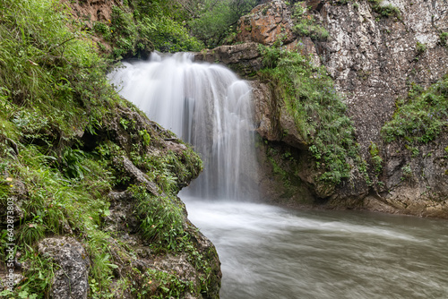 Beautiful summer mountain landscape with waterfall