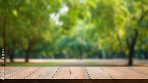Empty wooden table for product display. Blurred green nature park background