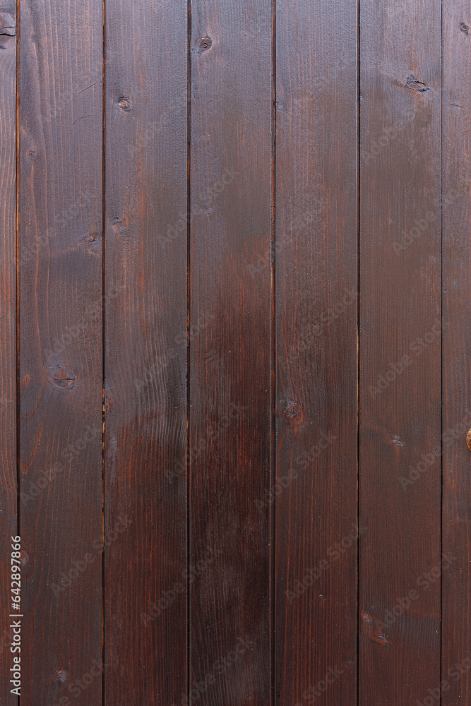 Naklejka premium Brown vertical wooden background