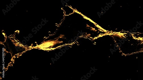 Super Slow Motion of Splashing Rotating Golden Liquid Isolated on Black Background. Filmed on High Speed Cinema Camera, 1000 fps. photo
