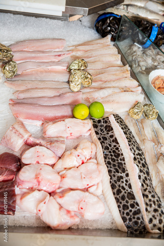 A variety of different seafood on the counter, on ice, at the fish market in Finland