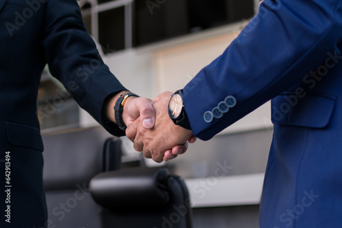 Konstfotografi Two diverse professional business men executive leaders shaking hands at office