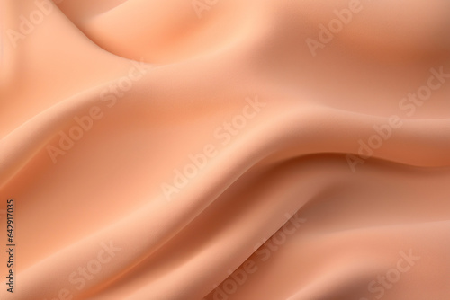 An abstract image featuring apricot-colored waves and shapes on a soft, silky fabric background. The design is elegant and flowing, making it suitable for fashion and textile applications.