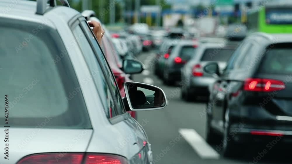 Large queue of vehicles on motorway pay toll in summer Large queue of vehicles on motorway pay toll in summer