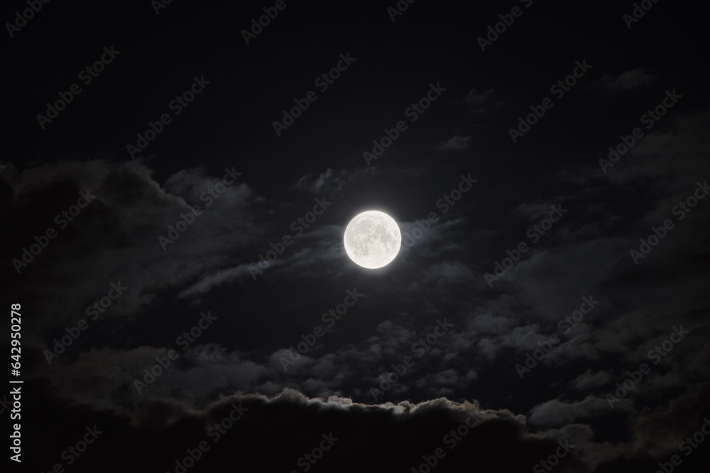 full moon and clouds in the night sky full moon and clouds in the night sky