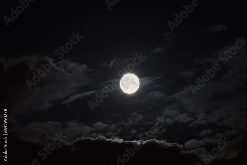 full moon and clouds in the night sky