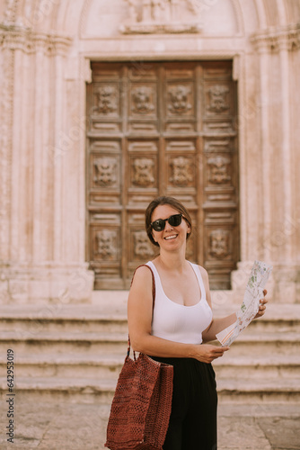 Female tourist with city ma...