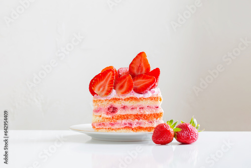 pink strawberry cake on white table