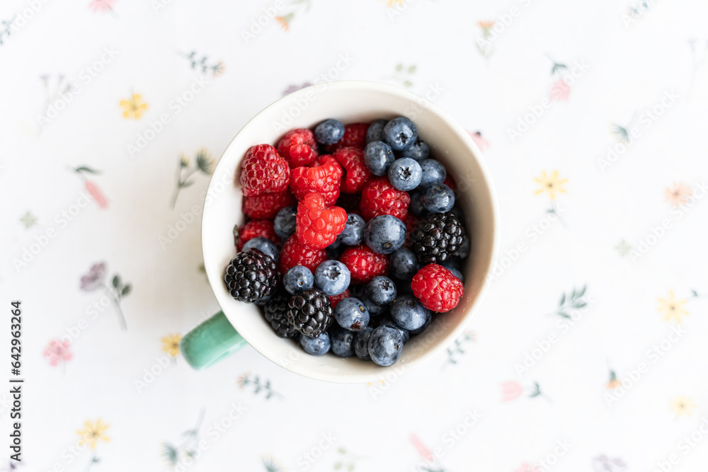Mix various of summer berries, wild berries in a ceramic bowl, top view. Mix various of summer berries, wild berries in a ceramic bowl, top view.