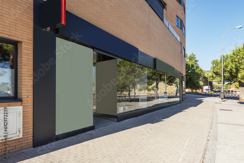 Image of a modern commercial premises at the foot of a wide street