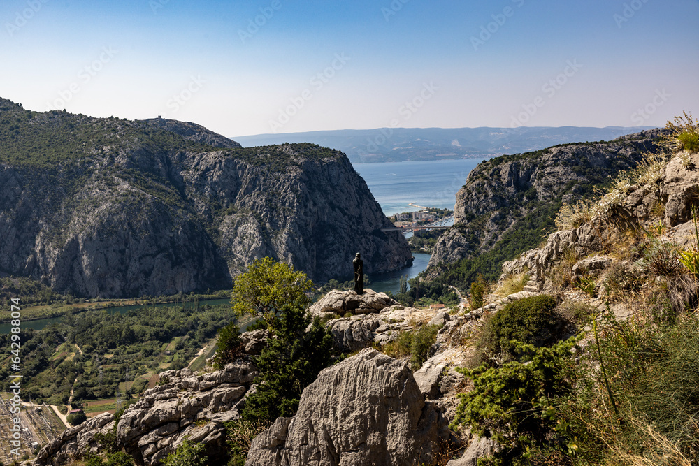 Fototapeta premium Captivating View from Mountains – town Omiš in Croatia, Cetina River, Adriatic, and Brac Island