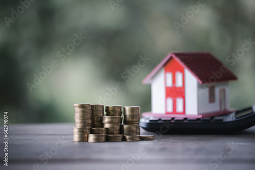 Home Loan and Coins in Serene Nature Background. Finance, Investment, and Real Estate Concept. Coins amidst Tranquil Nature Background. Financial Growth, Property Investment, and Savings.