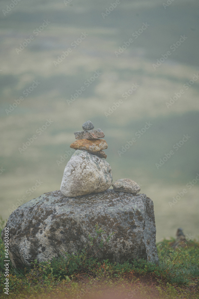 A Zen-style stone pyramid in a natural setting 