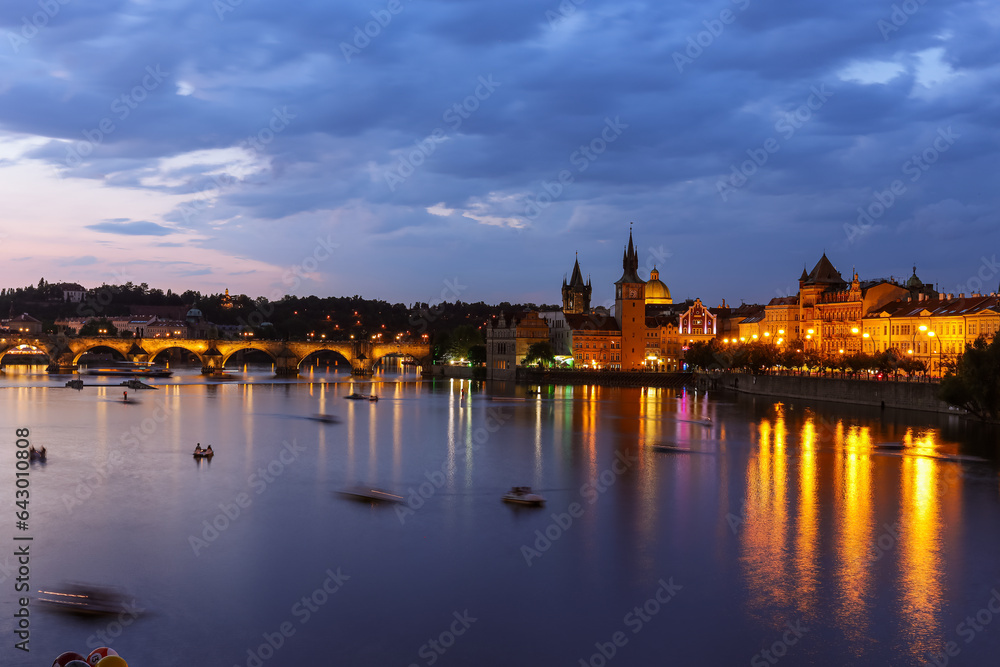 Prague medieval architecture and Charles bridge over Vltava river at night, Czech Republic