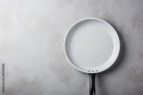 Ceramic frying pan on gray surface photo