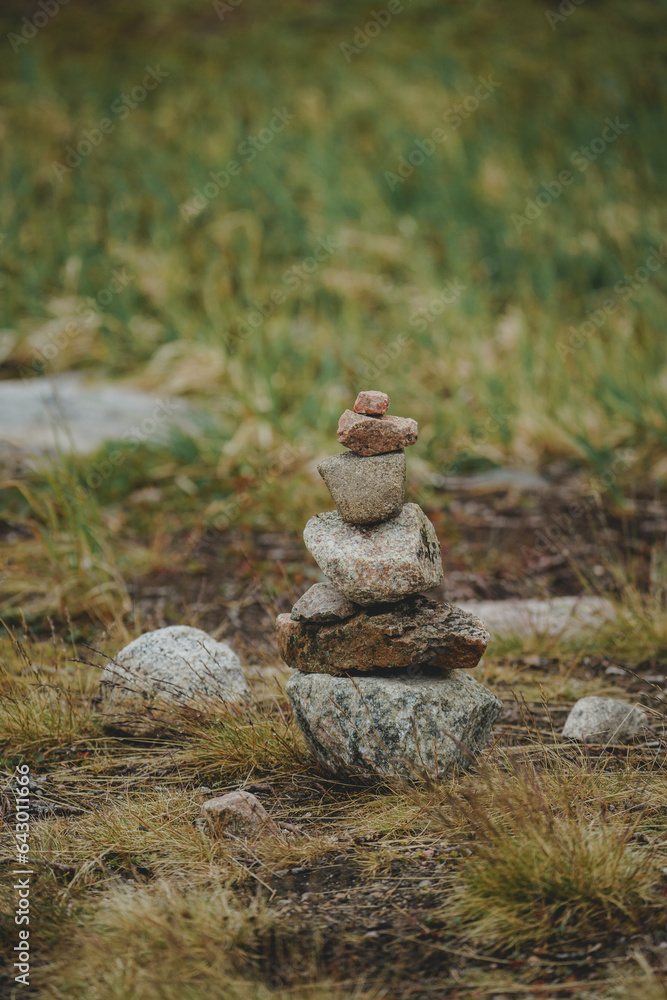 A Zen-style stone pyramid in a natural setting